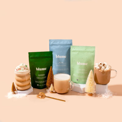 The Blume holiday bundle packages and Blume drinks in glass mugs.