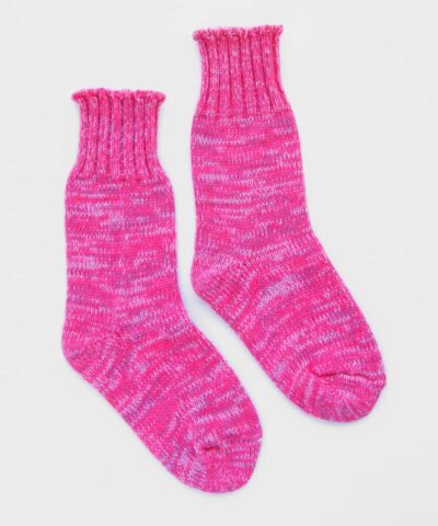 A pair of bright pink knit socks